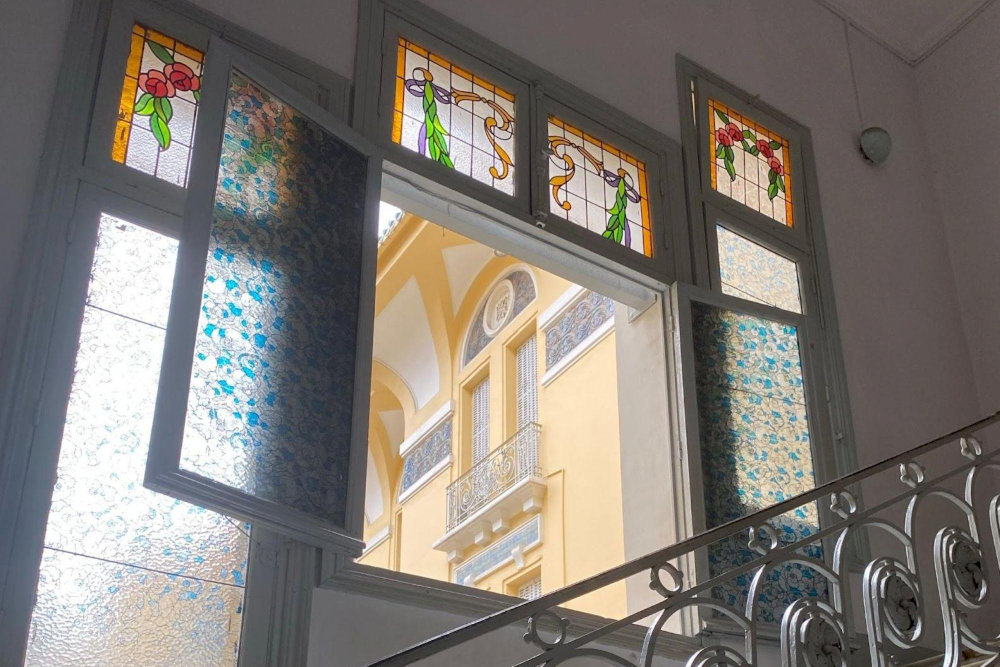 The stained-glass windows add a touch of brilliance to the space, especially during the day when sunlight streams through